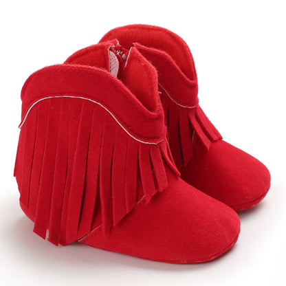 Girls' red fringe cowboy boots, bold and trendy western shoes for young children.