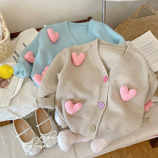 Toddler girl's pink knit sweater with white heart design, long sleeve, cotton blend for winter wear