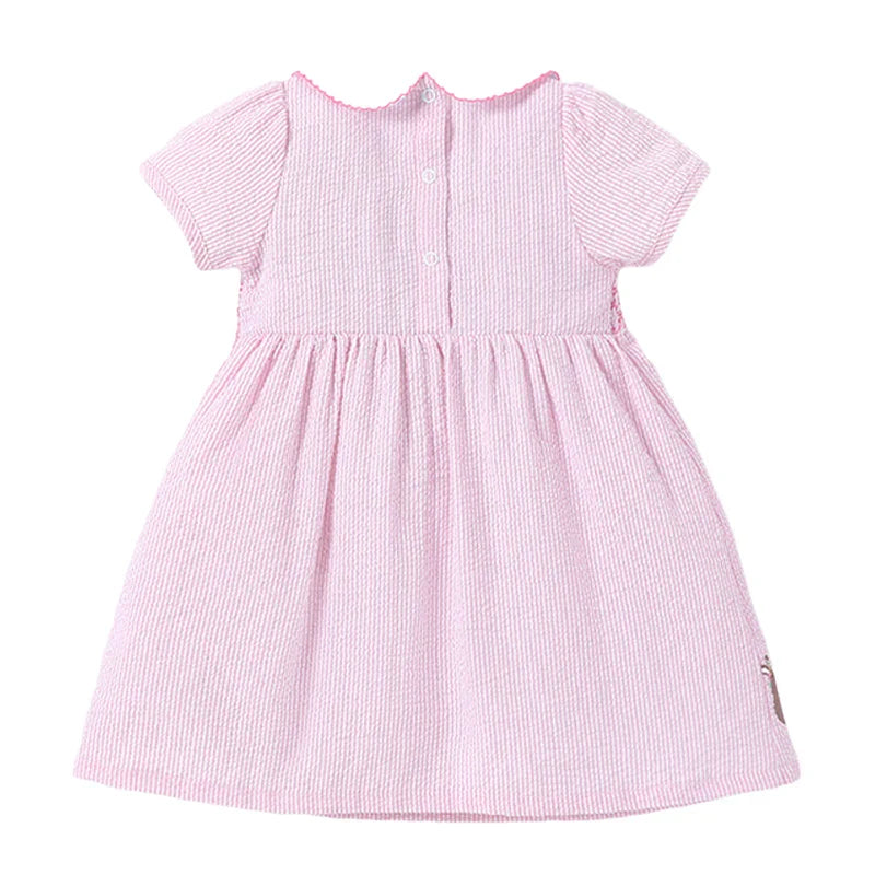 Close-up of the delicate rabbit print on a girls' pink cotton blend summer dress, perfect for kids.