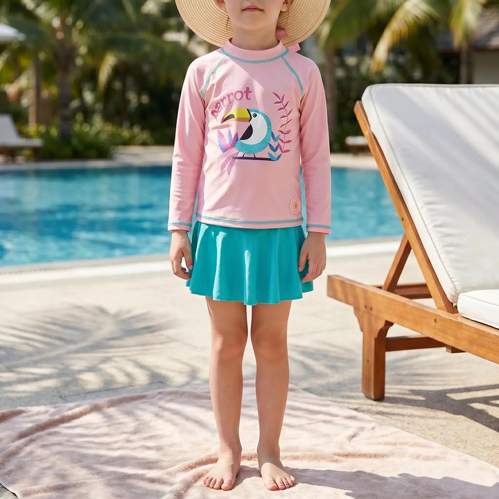Toddler girl's pink & yellow three-piece rash guard swimsuit with sun hat for ultimate UV protection.