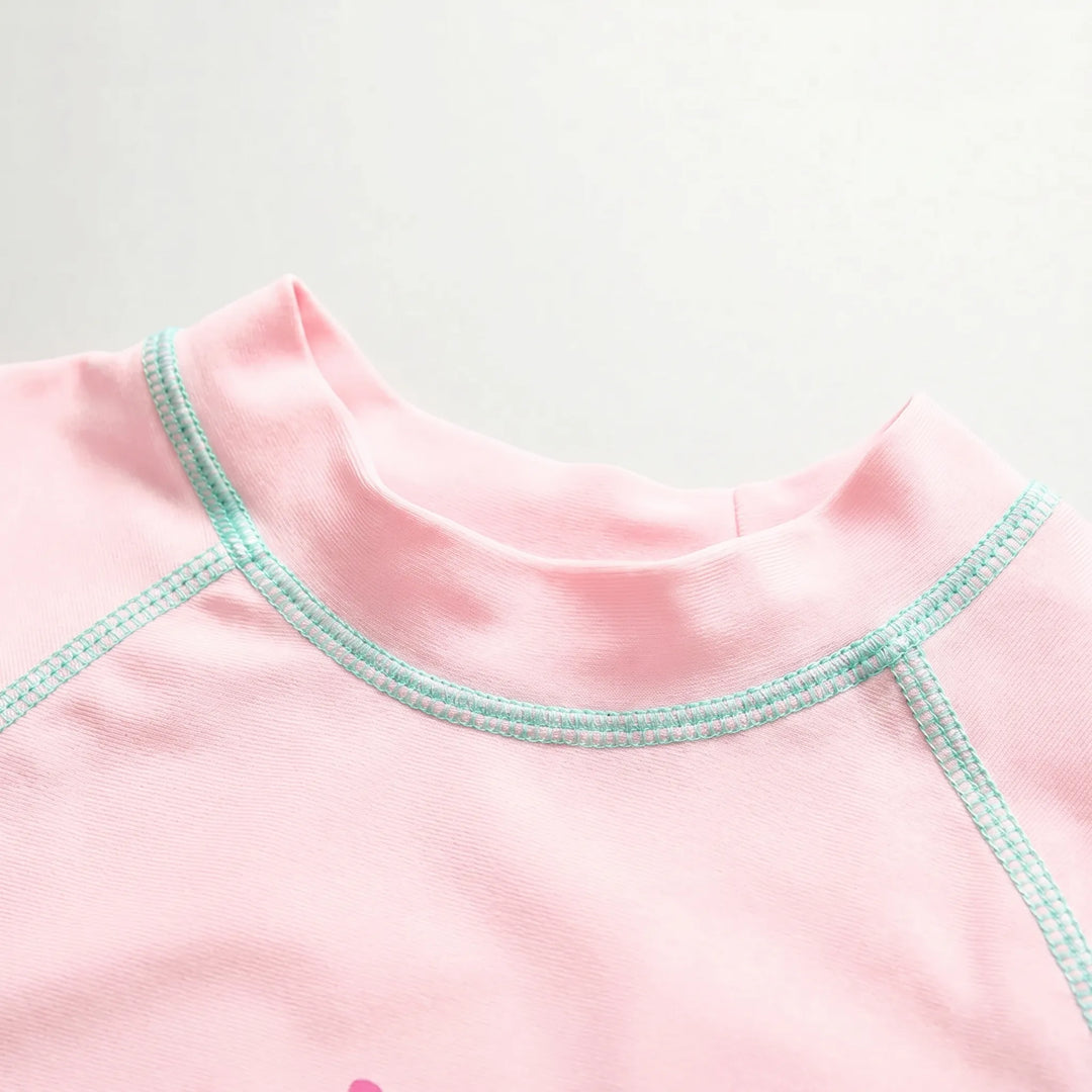 Quick-dry pink & yellow girls' rash guard swimsuit and hat; perfect three-piece toddler swimwear for play.