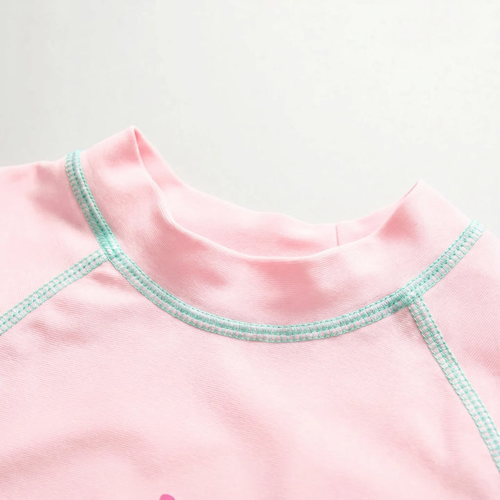Quick-dry pink & yellow girls' rash guard swimsuit and hat; perfect three-piece toddler swimwear for play.