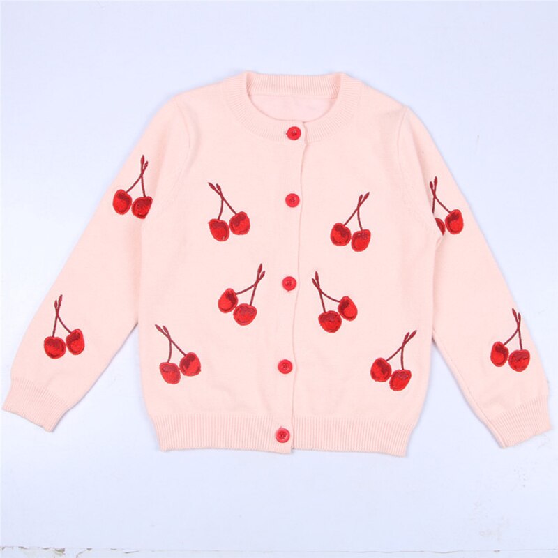 Baby girl in a cute plaid knitted cardigan, fashionable and warm kids clothing