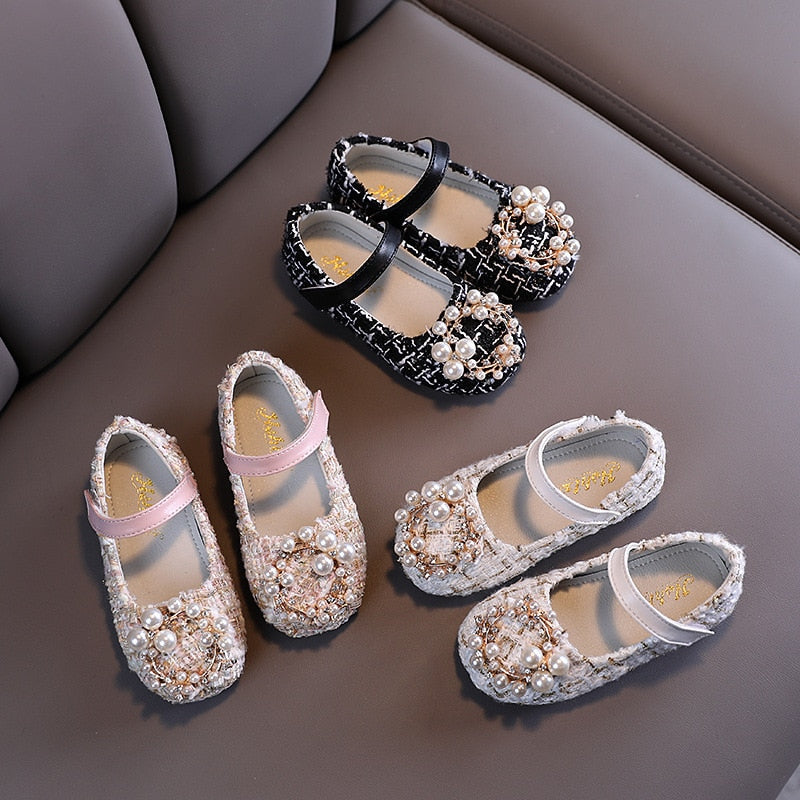 Toddler girl's plaid sandals with pearl embellishments, perfect for baby's first steps.