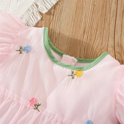 Fashionable girls' summer dress, detailed with a beautiful floral print and back bow.