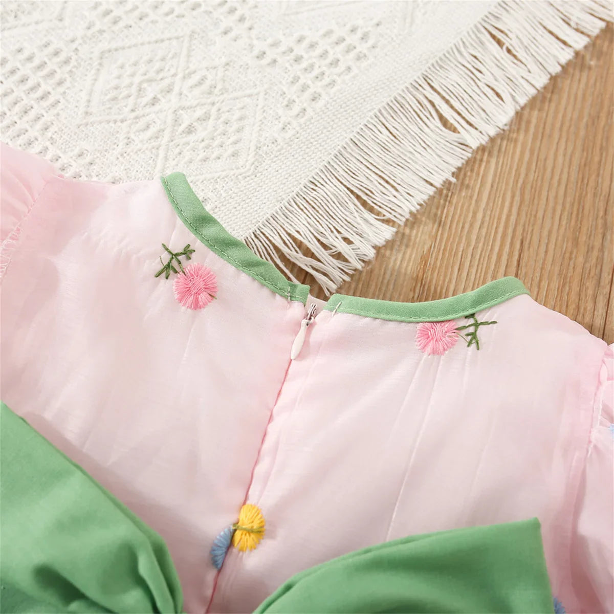 Spring apparel: Baby girl's casual floral party dress with charming back bow detail.