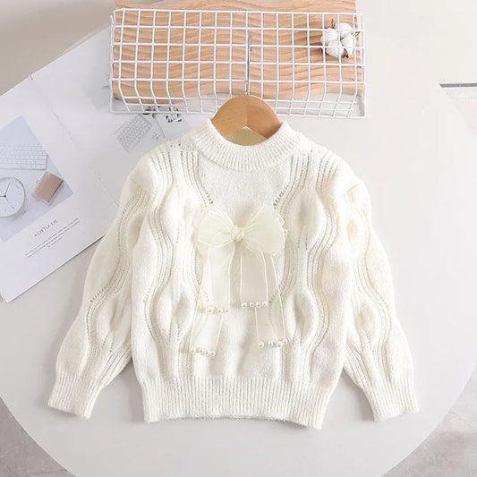 Toddler girl's warm pink knitted long-sleeve sweater with bow detail, cotton blend