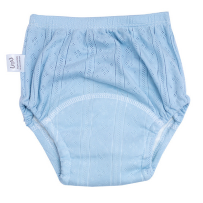 Child reaching for pair of soft blue cotton potty training pants, encouraging potty training journey.