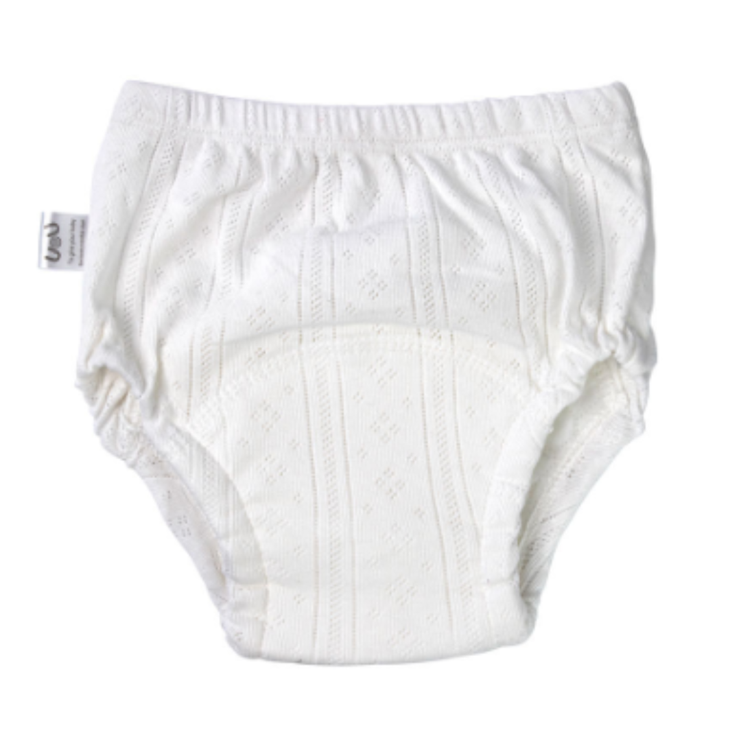 Close-up of blue reusable cotton potty training pants for boys, showing absorbent layers, baby clothing.