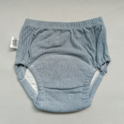 Set of colorful washable cotton training pants for toddlers, gender-neutral designs, reusable diapers.