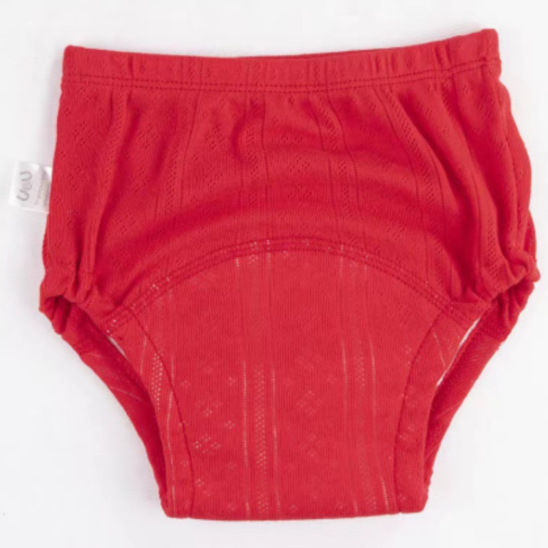 Stack of folded organic cotton potty training pants, various sizes, eco-friendly baby essentials.