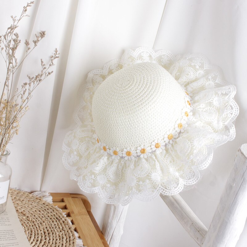 Foldable kids' sunflower straw hat for easy packing, a must-have baby accessory for travel