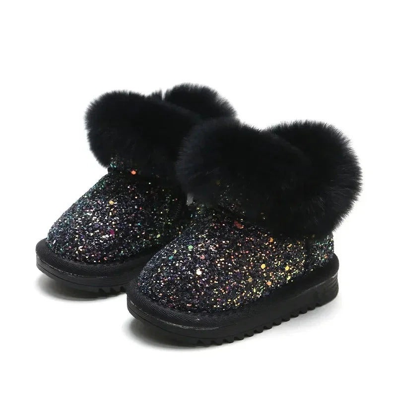 Pair of blue glitter winter boots for kids, offering cozy warmth for boys and girls