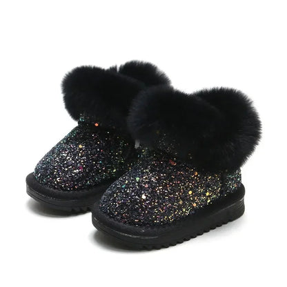 Pair of blue glitter winter boots for kids, offering cozy warmth for boys and girls