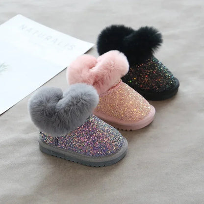 Purple glitter toddler boots on a white background, highlighting the soft lining and quality stitching