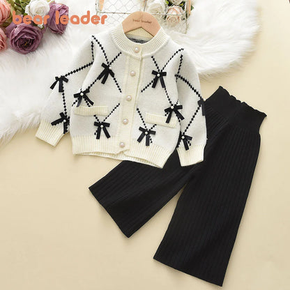 Girls' cozy knitted winter sweatshirt with elastic cuffs and waistband, paired with matching pants.