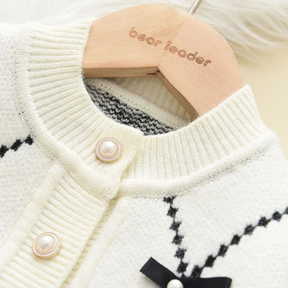 Detail of printed design on the front of a girls' knitted winter sweatshirt, comfortable acrylic.