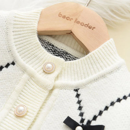 Detail of printed design on the front of a girls' knitted winter sweatshirt, comfortable acrylic.