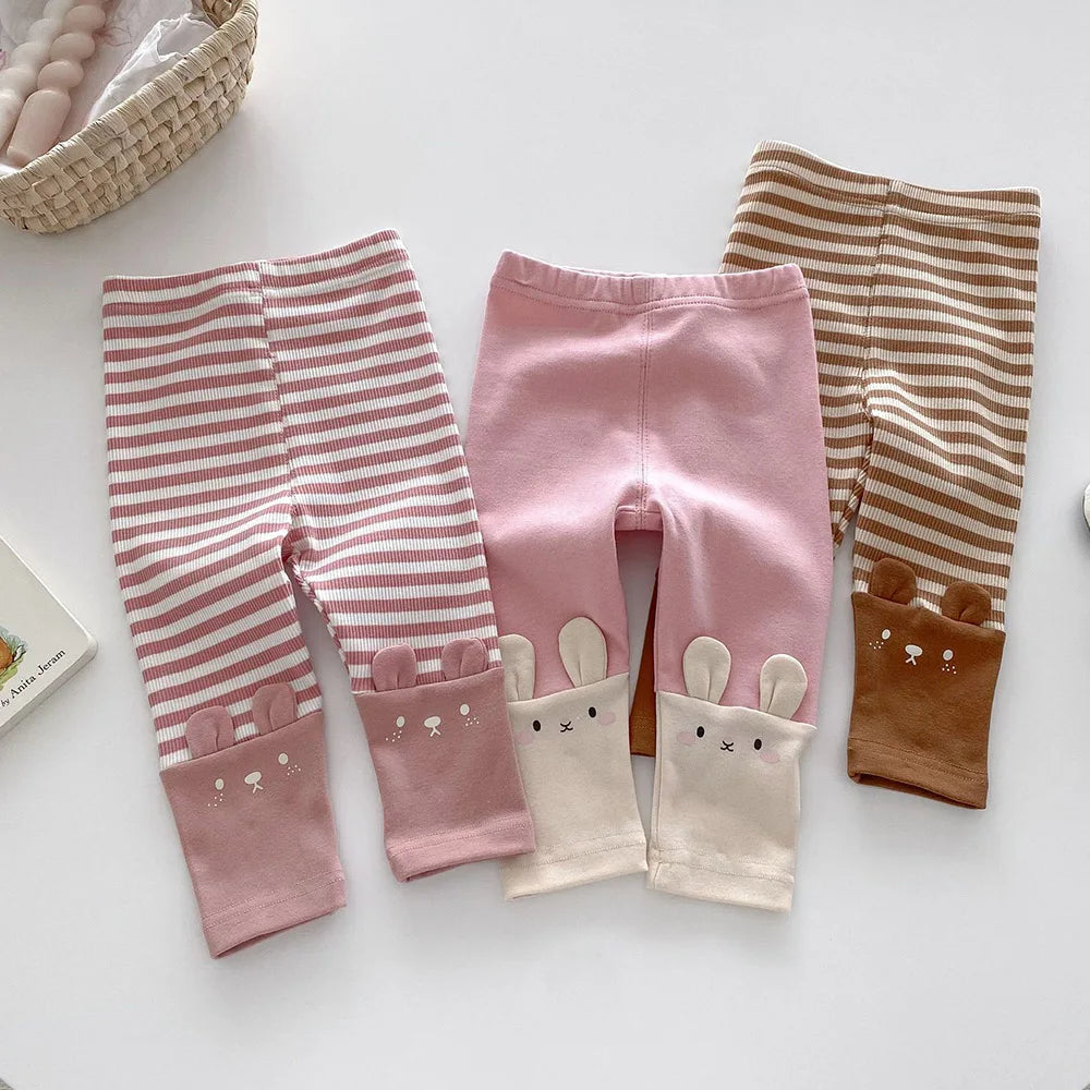 Toddler girl wearing pink soft cotton everyday leggings, perfect for active play and comfort.