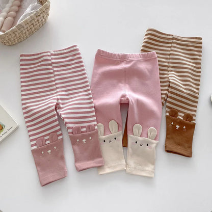 Toddler girl wearing pink soft cotton everyday leggings, perfect for active play and comfort.