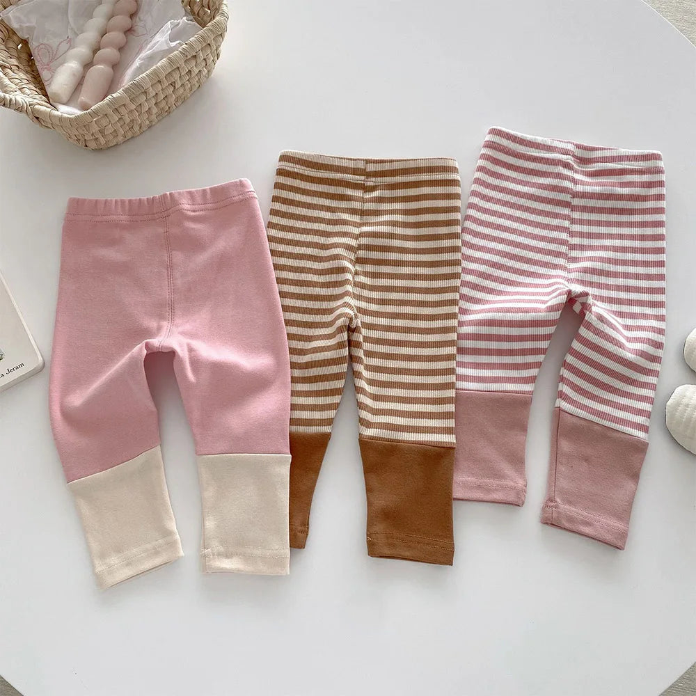 Pair of comfortable navy blue kids' cotton leggings, ideal for everyday wear, durable for active children.