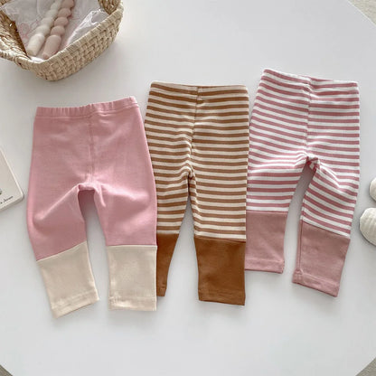Pair of comfortable navy blue kids' cotton leggings, ideal for everyday wear, durable for active children.