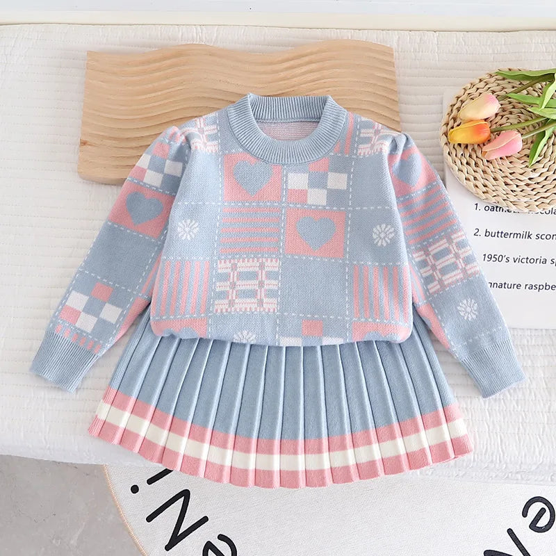 Toddler girls' blue knit sweater and pant set, cozy winter outfit for children.