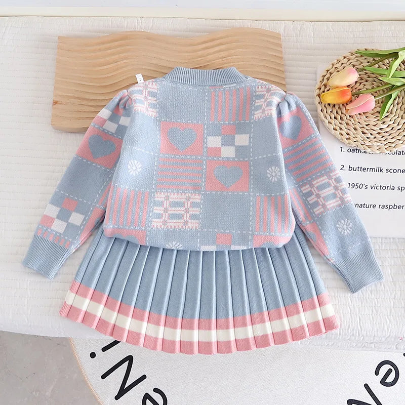 Cozy pink knit sweater and pant set for toddlers, perfect for children's winter fashion.