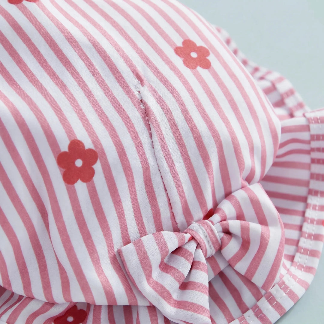 Long-sleeve rashguard swimsuit for toddler girls with a wide-brim sun hat. Ideal for active children's swimwear.