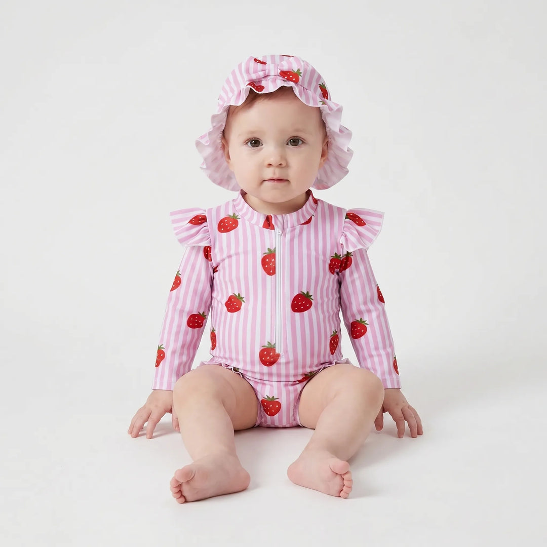 Adorable striped toddler girls' rashguard swimsuit with long sleeves & sun hat. Stylish and protective beach outfit.