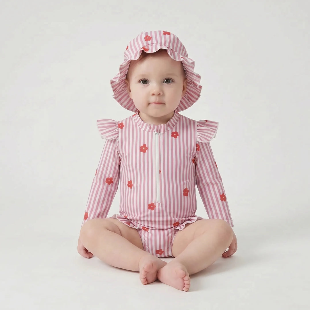 Summer-ready toddler girls' long-sleeve rashguard swimsuit & sun hat. Perfect for beach days & outdoor play.