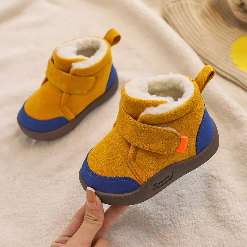 Toddler girls' soft winter boots, showcasing high-top design and plush material for ultimate warmth