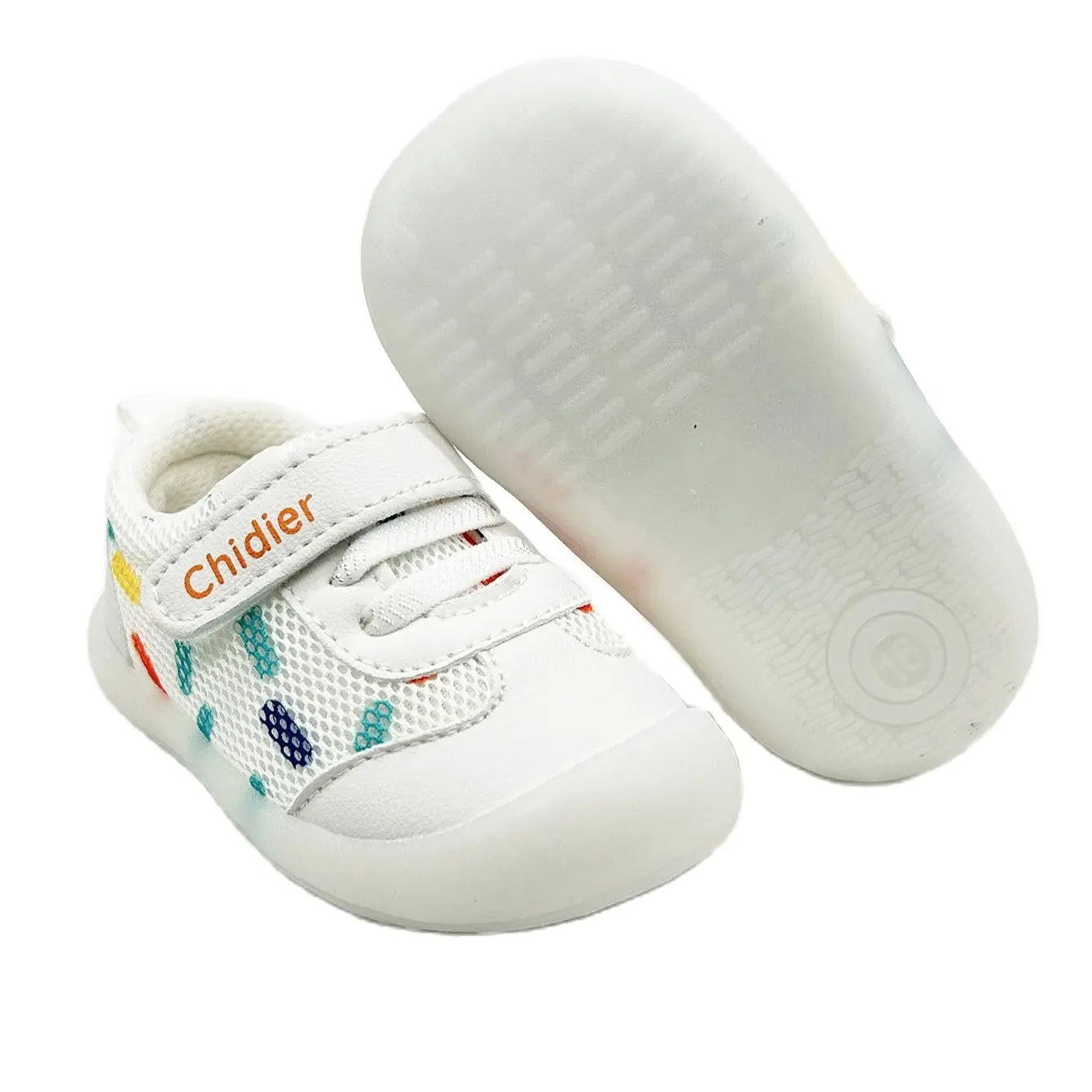 Side view of cheerful polka dot baby sneakers for girls, emphasizing lightweight design and comfortable fit.