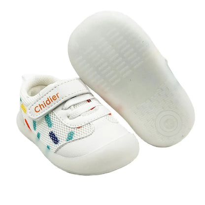 Side view of cheerful polka dot baby sneakers for girls, emphasizing lightweight design and comfortable fit.