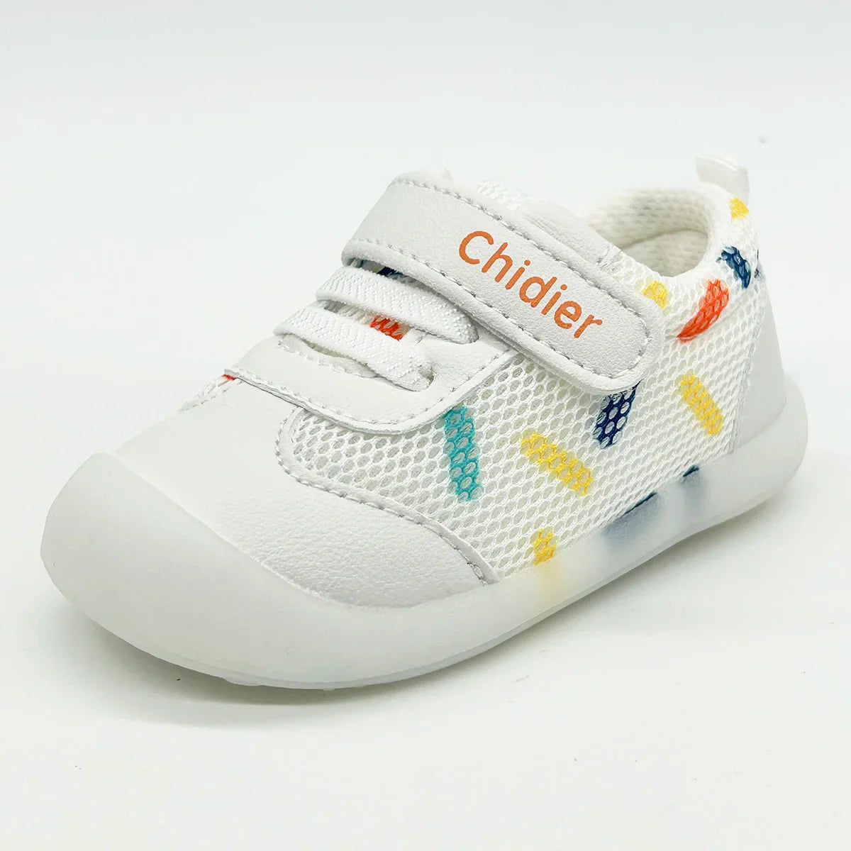 Toddler girl's feet wearing cute polka dot trainers, featuring breathable construction and convenient hook and loop.