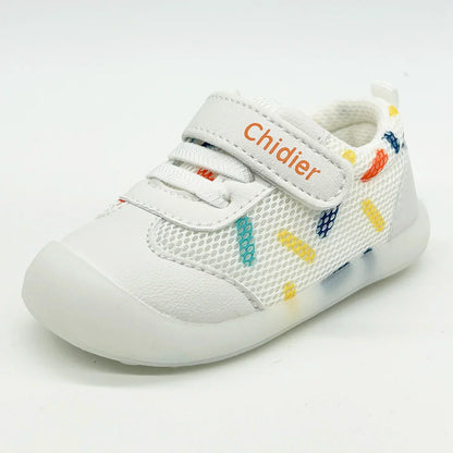Toddler girl's feet wearing cute polka dot trainers, featuring breathable construction and convenient hook and loop.