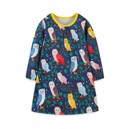 Detailed view of the lively racing horse print on this toddler girls' long sleeve cotton dress.