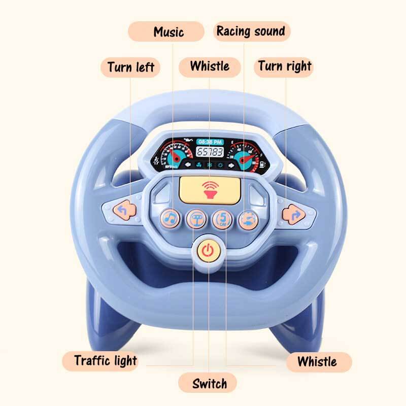 Close-up of a child gripping a steering wheel toy, engaging with buttons and switches.