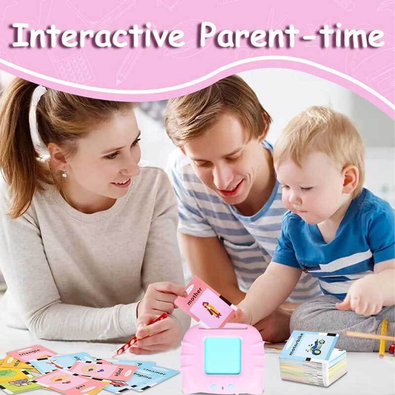Toddler boy happily playing with interactive talking flashcards, an engaging early learning toy.