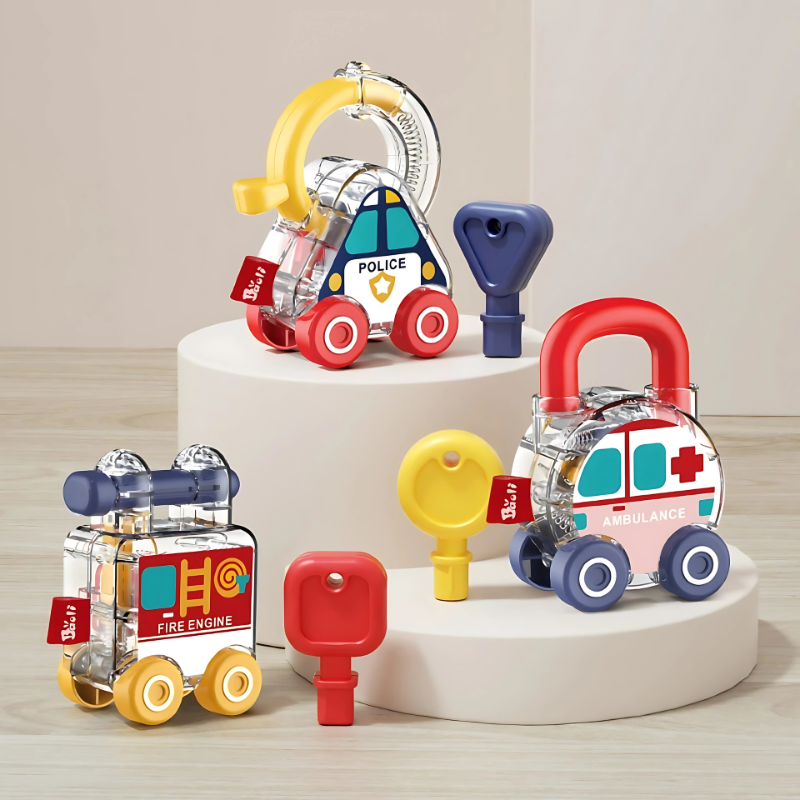 Toddler holding key to unlock colorful emergency vehicle toy enhancing fine motor skills & shape recognition