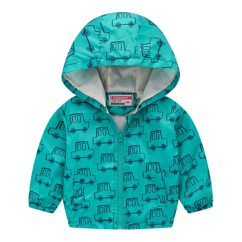 Close-up of the waterproof fabric on a children's floral hooded windbreaker jacket, outdoor gear.