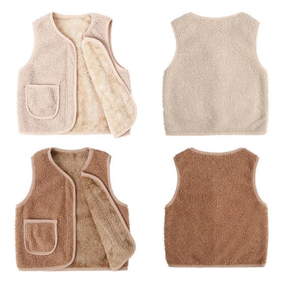 Warm kids lambswool vest in a neutral color, open over a long-sleeve, ideal for winter outdoor play.