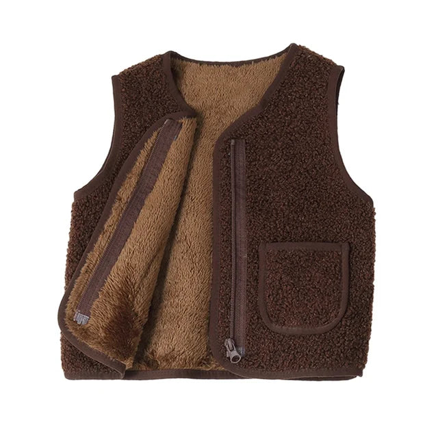 Kids layering with a warm lambswool vest, showcasing its unisex design and cozy winter appeal.