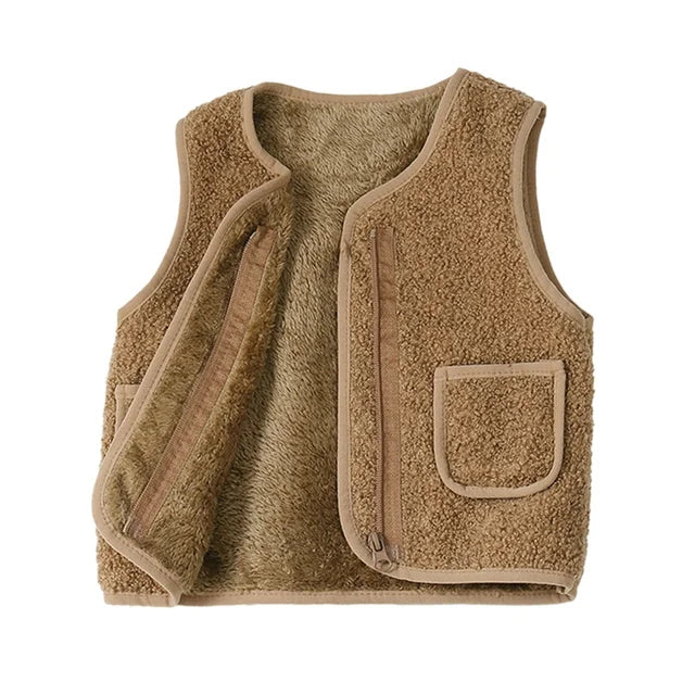 Detailed shot of the knit pattern on a lambswool cardigan vest, perfect for keeping toddlers warm.