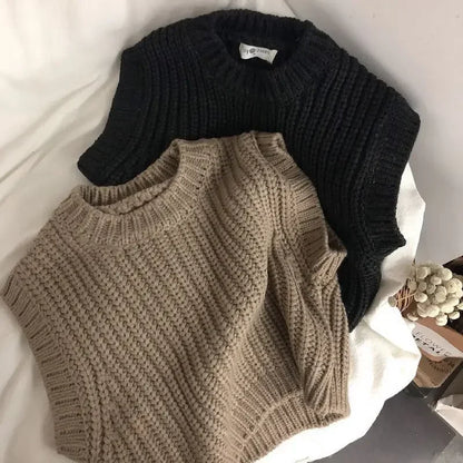 Toddler in a cozy, soft knitted cotton sweater, perfect for autumn warmth and play.