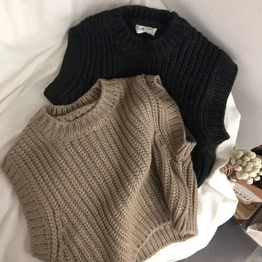 Toddler in a cozy, soft knitted cotton sweater, perfect for autumn warmth and play.