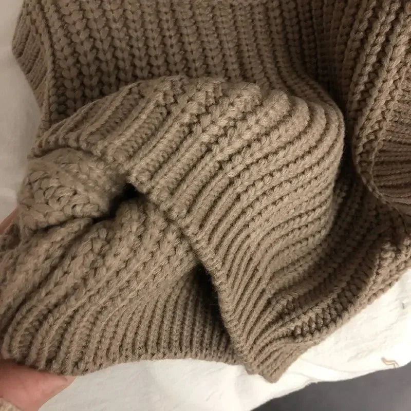 Fashionable knitted sweater for toddlers, featuring a comfortable design for autumn wear.