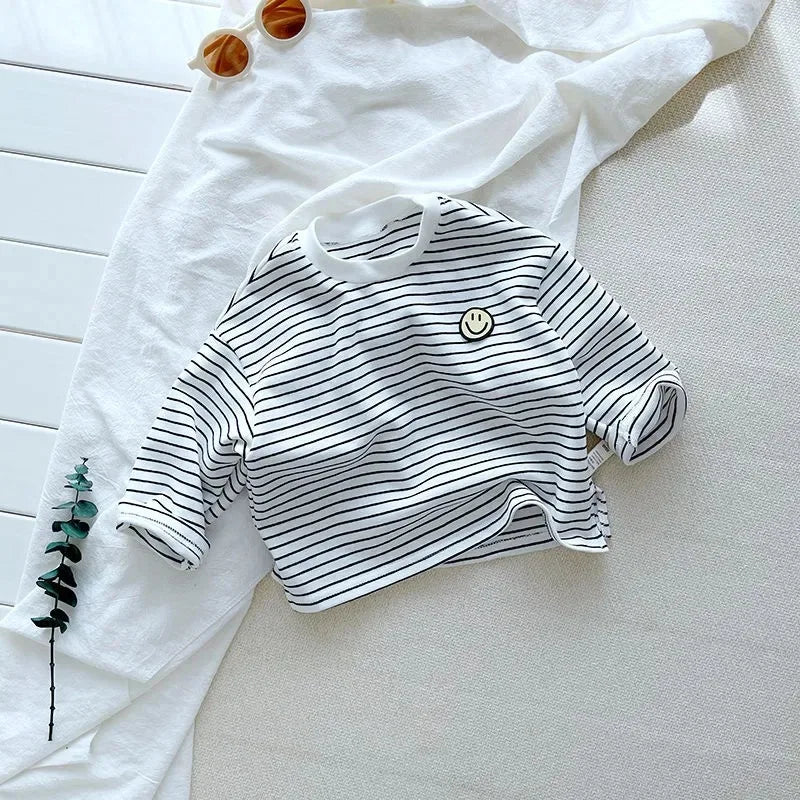 Unisex long sleeve cotton shirt for kids, featuring a comfortable design and classic stripes.