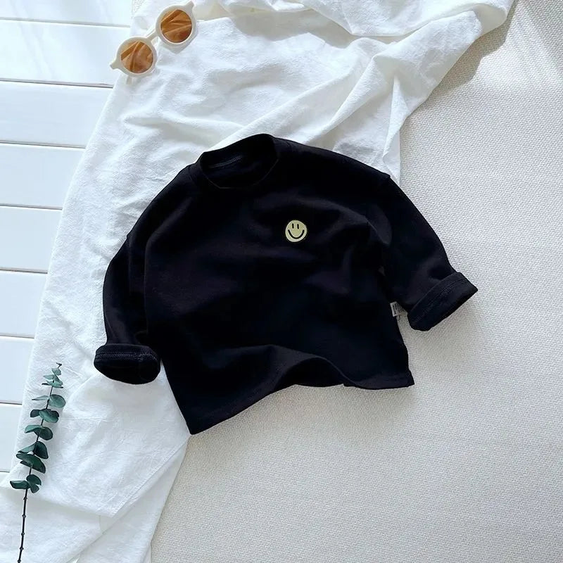 Close-up of a soft cotton long sleeve shirt, ideal for baby & toddler fashion, durable children's wear.