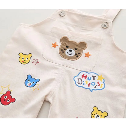 Close-up of soft cotton striped overalls for toddlers, featuring a front pocket.